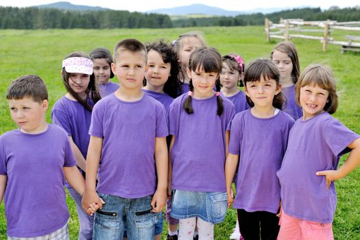 happy kids group have fun in nature outdoors park