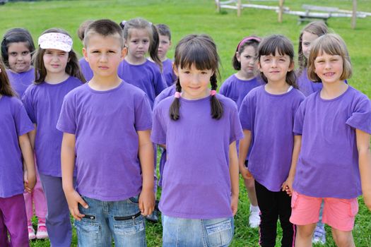 happy kids group have fun in nature outdoors park