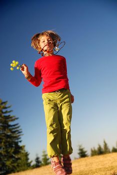 happy child jumping in nature