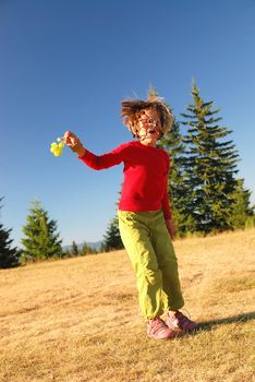 happy child jumping in nature