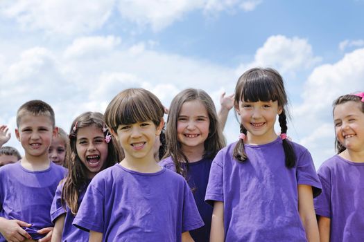 happy kids group have fun in nature outdoors park