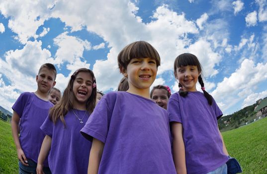 happy kids group have fun in nature outdoors park