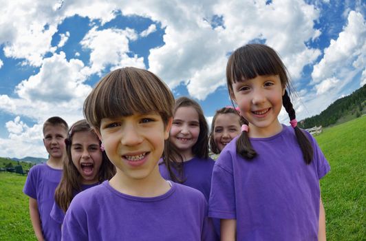 happy kids group have fun in nature outdoors park