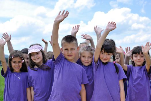 happy kids group have fun in nature outdoors park