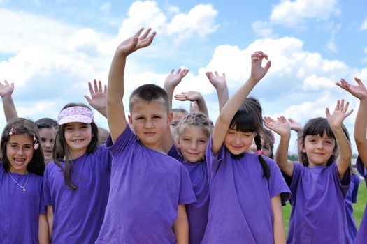 happy kids group have fun in nature outdoors park