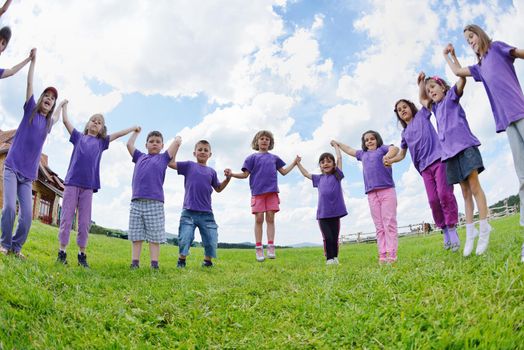 happy kids group have fun in nature outdoors park