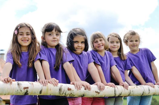 happy kids group have fun in nature outdoors park