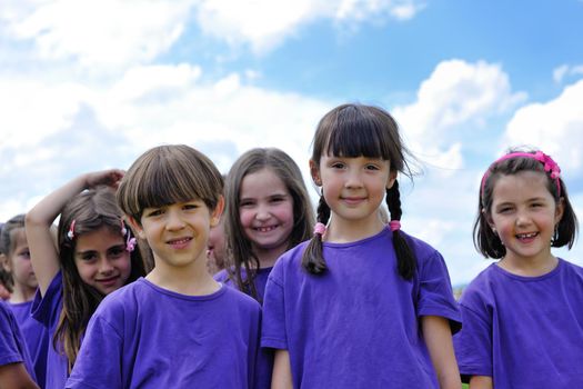 happy kids group have fun in nature outdoors park