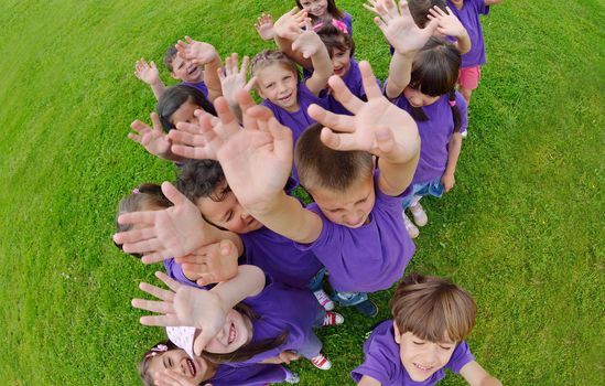 happy kids group have fun in nature outdoors park