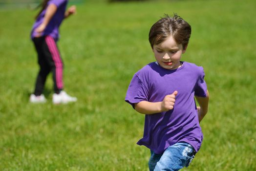 happy kids group have fun in nature outdoors park