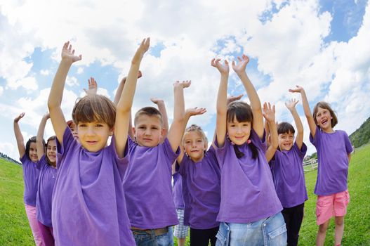 happy kids group have fun in nature outdoors park