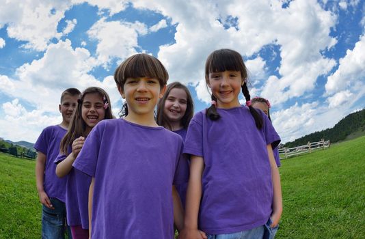 happy kids group have fun in nature outdoors park