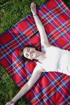 Enjoying the nature and life. Young woman arms raised enjoying the fresh air in green nature