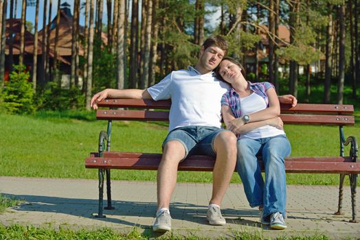 Portrait of romantic young couple in love  smiling together outdoor in nature with blue sky in background