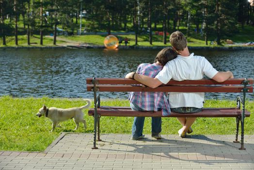 Portrait of romantic young couple in love  smiling together outdoor in nature with blue sky in background