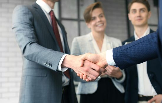 Business people shaking hands, finishing up a meeting