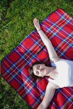 Enjoying the nature and life. Young woman arms raised enjoying the fresh air in green nature