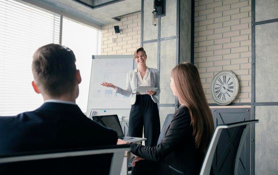 business conference presentation with team training flipchart office