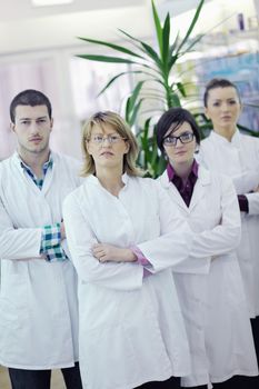 team of  pharmacist chemist woman and man  group  standing in pharmacy drugstore
