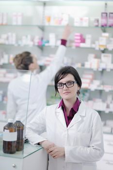 team of  pharmacist chemist woman group  standing in pharmacy drugstore