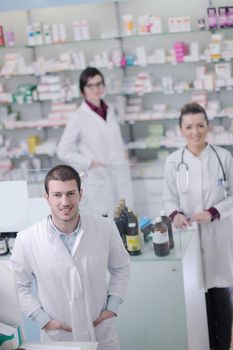 team of  pharmacist chemist woman and man  group  standing in pharmacy drugstore