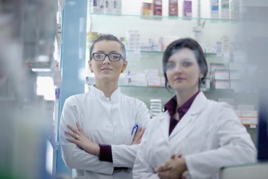 team of  pharmacist chemist woman group  standing in pharmacy drugstore