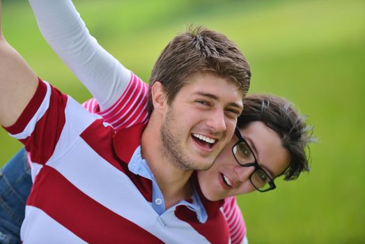 Portrait of romantic young couple in love  smiling together outdoor in nature with blue sky in background