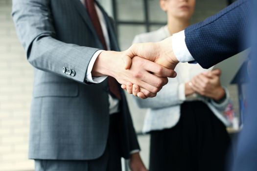 Business people shaking hands, finishing up a meeting