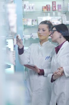 team of  pharmacist chemist woman group  standing in pharmacy drugstore