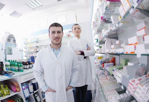 team of  pharmacist chemist woman and man  group  standing in pharmacy drugstore