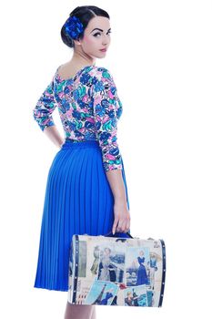 pretty young happy woman with travel bag waiting and posing isolated on white backround  in studio