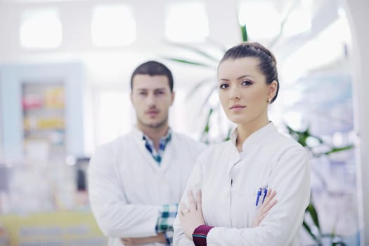 team of  pharmacist chemist woman group  standing in pharmacy drugstore