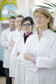 team of  pharmacist chemist woman and man  group  standing in pharmacy drugstore