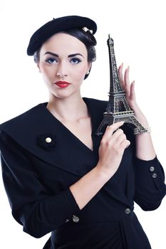 beautiful young woman hold paris symbol eiffel tower isolated on white background and representing travel and tourist concept