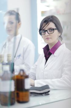 team of  pharmacist chemist woman group  standing in pharmacy drugstore