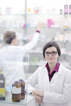 team of  pharmacist chemist woman group  standing in pharmacy drugstore