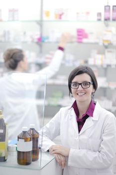 team of  pharmacist chemist woman group  standing in pharmacy drugstore