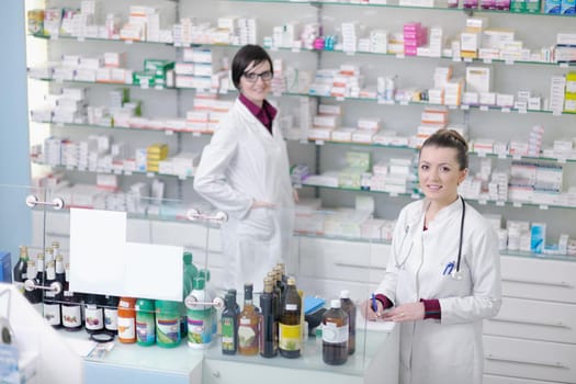 team of  pharmacist chemist woman group  standing in pharmacy drugstore