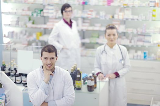 team of  pharmacist chemist woman and man  group  standing in pharmacy drugstore