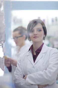 team of  pharmacist chemist woman group  standing in pharmacy drugstore