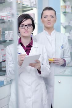 team of  pharmacist chemist woman group  standing in pharmacy drugstore