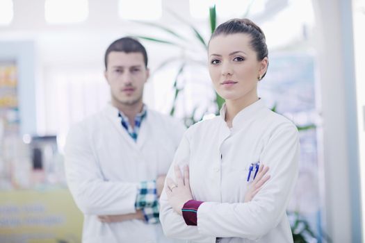 team of  pharmacist chemist woman and man  group  standing in pharmacy drugstore