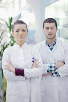 team of  pharmacist chemist woman and man  group  standing in pharmacy drugstore