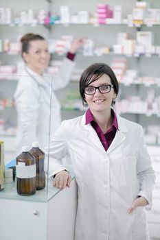 team of  pharmacist chemist woman group  standing in pharmacy drugstore