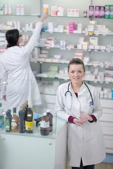 team of  pharmacist chemist woman group  standing in pharmacy drugstore