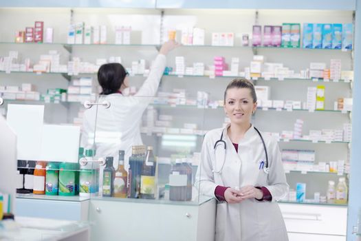 team of  pharmacist chemist woman group  standing in pharmacy drugstore