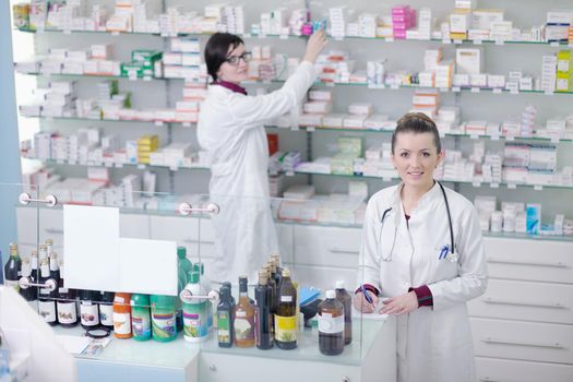 team of  pharmacist chemist woman group  standing in pharmacy drugstore