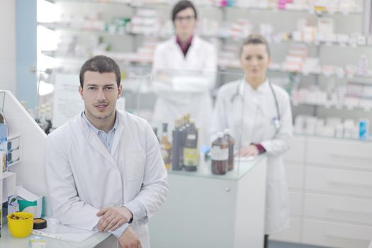 team of  pharmacist chemist woman and man  group  standing in pharmacy drugstore