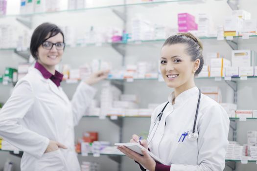 team of  pharmacist chemist woman group  standing in pharmacy drugstore