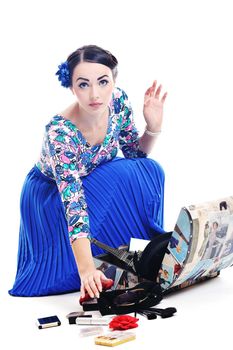 pretty young happy woman with travel bag waiting and posing isolated on white backround  in studio